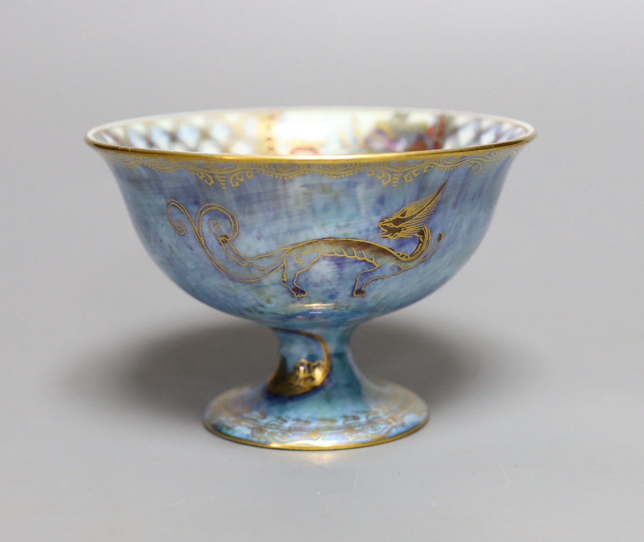 A Wedgwood blue lustre chinoiserie pedestal bowl, designed by Daisy Makeig Jones, pattern number Z4829, 8 cms high